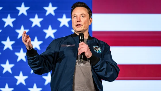  Elon Musk speaking at a Tesla event, showcasing his leadership in innovation.