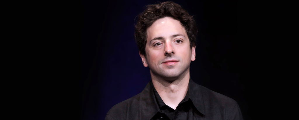 Sergey Brin discussing AI advancements at an Alphabet event.