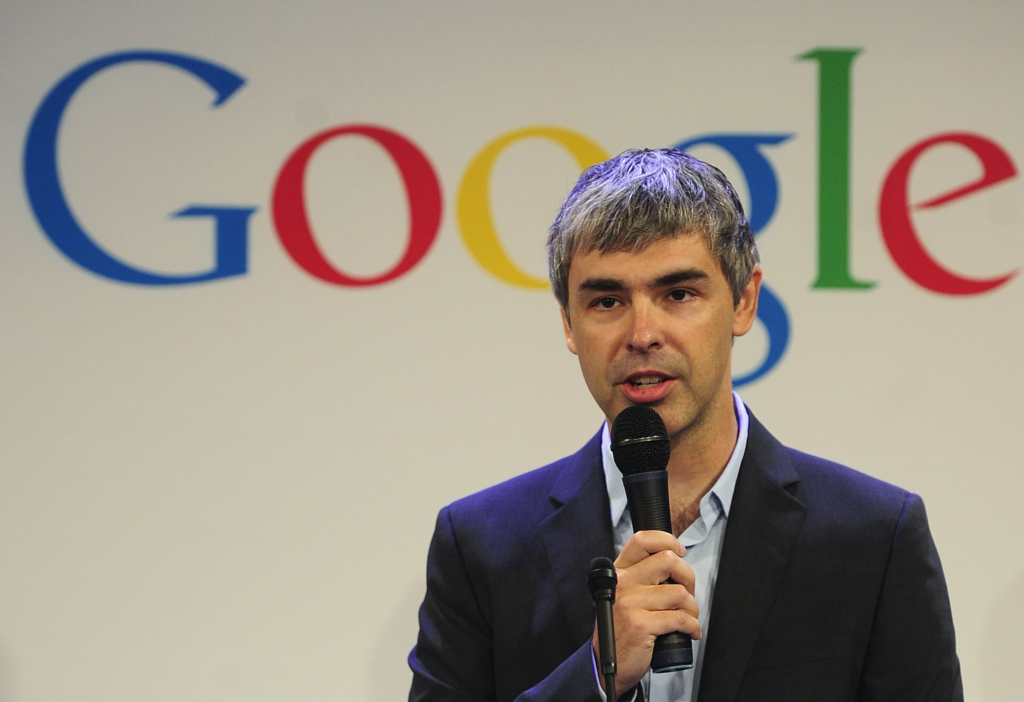 Larry Page showcasing a self-driving car prototype