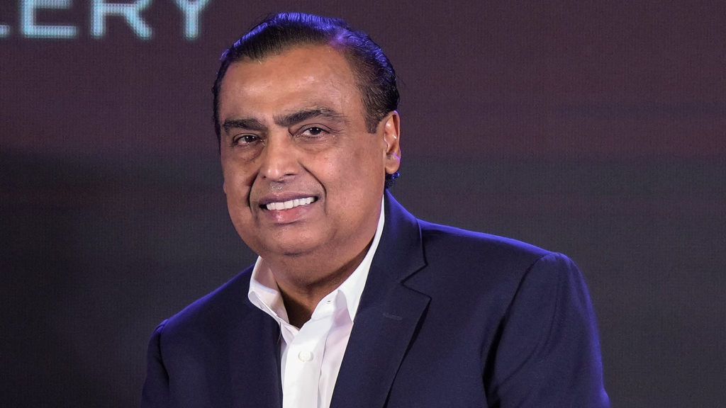 Mukesh Ambani addressing stakeholders at a Reliance AGM.